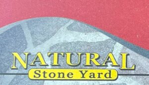 red and grey background with yellow lettering in the foreground that reads: Natural Stone Yard