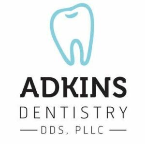 Adkins dentistry logo with a giant molar.
