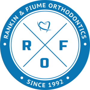 An X with a tooth on top, an O on the bottom, an R to the left, and an F to the right. Rankin & Fiume orthodontist logo